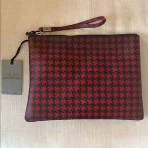 Clutch handbag with wrist strap